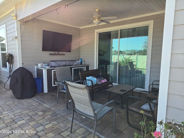 view of patio featuring an outdoor hangout area and ceiling fan