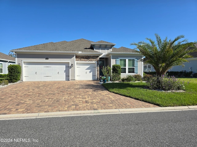 view of front of property featuring a garage