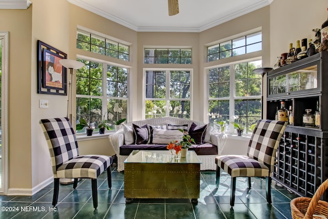 sunroom featuring a wealth of natural light and ceiling fan