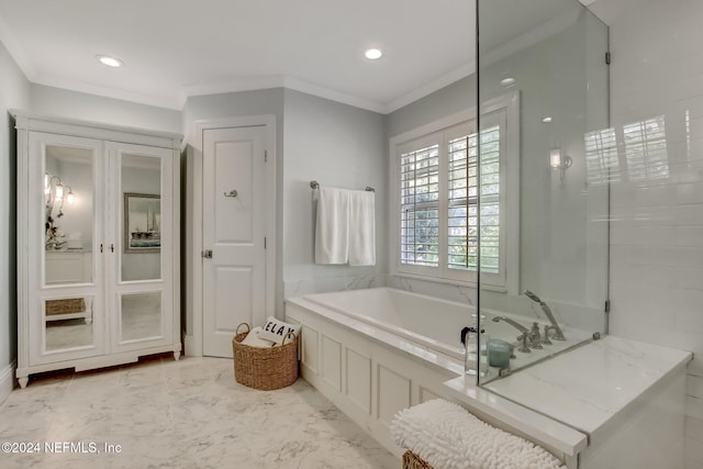 bathroom featuring crown molding and a bath