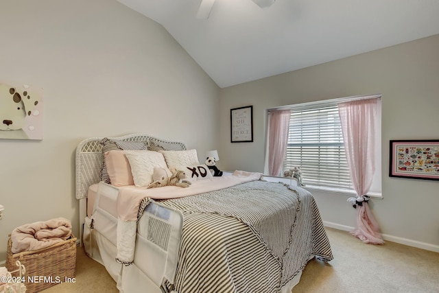 carpeted bedroom with ceiling fan and vaulted ceiling