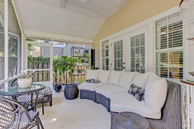 sunroom featuring vaulted ceiling