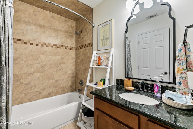 bathroom featuring vanity and shower / tub combo