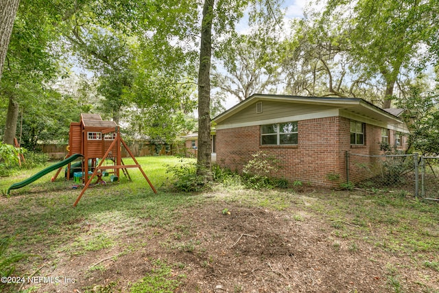 view of yard with a playground