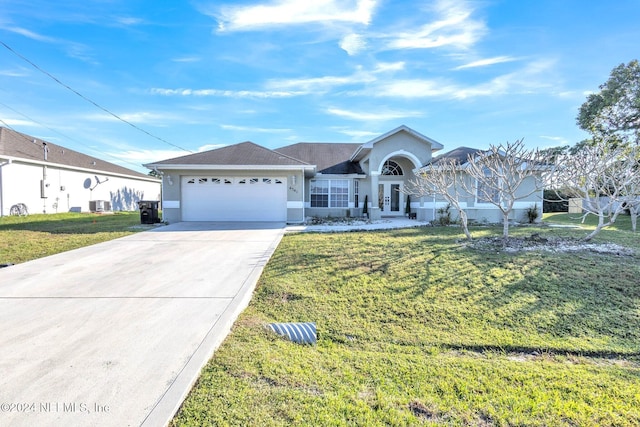 ranch-style house with a front yard, french doors, a garage, and central air condition unit