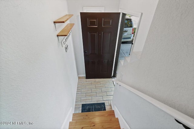 interior space featuring wood-type flooring and a fireplace