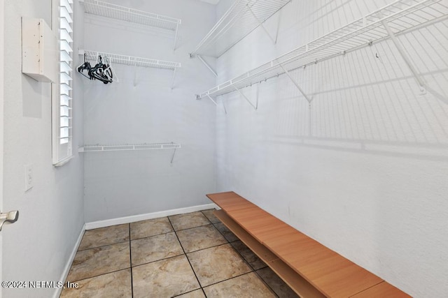 walk in closet featuring light tile patterned floors