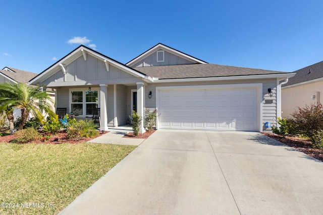 view of front of house with a garage and a front lawn