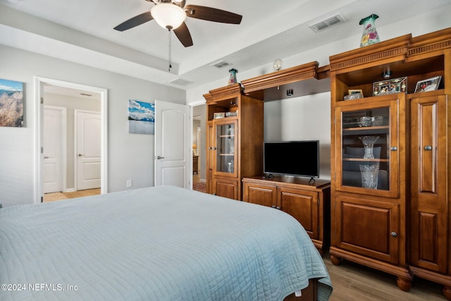 bedroom featuring ceiling fan and wood-type flooring