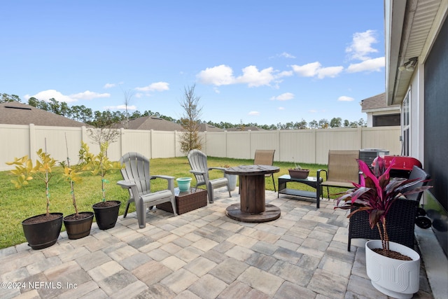 view of patio / terrace with an outdoor fire pit