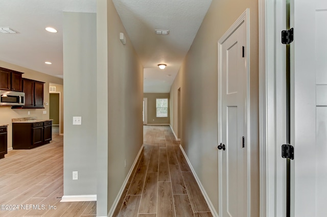 hall featuring light hardwood / wood-style floors