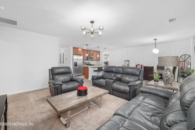 living area with light carpet, a chandelier, visible vents, and baseboards