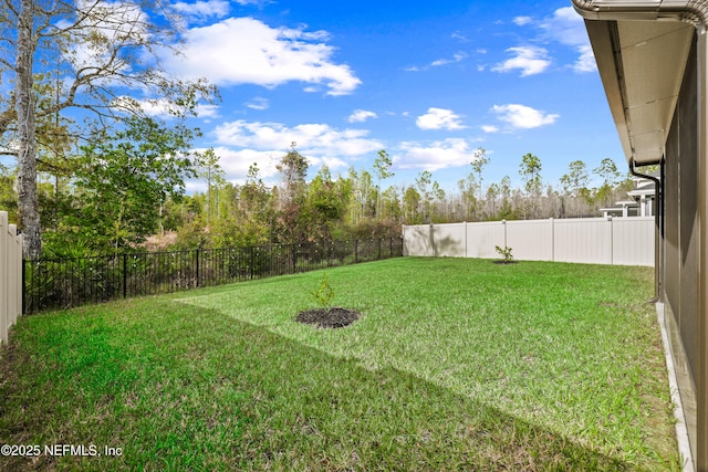 view of yard with a fenced backyard