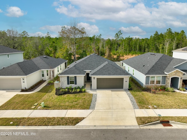 ranch-style house with a garage, driveway, and a front lawn