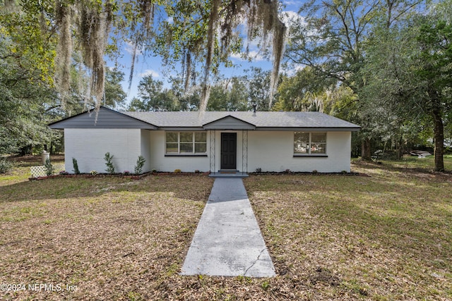 ranch-style house with a front yard