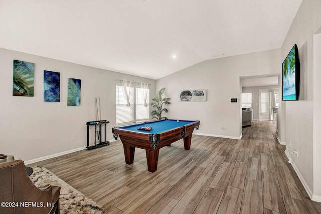 rec room with vaulted ceiling, light hardwood / wood-style flooring, a healthy amount of sunlight, and pool table