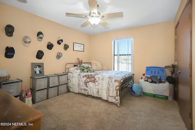 carpeted bedroom with ceiling fan