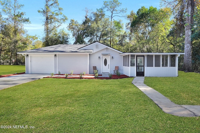 ranch-style home with a sunroom, a garage, and a front lawn