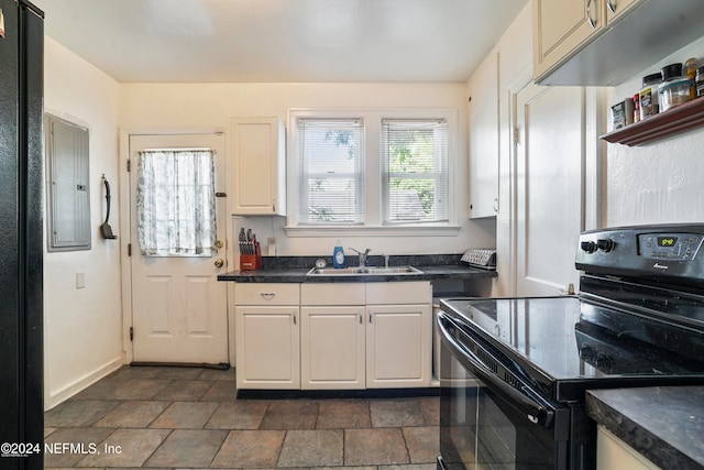 kitchen with black range with electric stovetop, white cabinetry, sink, and electric panel