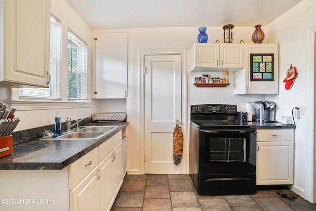 kitchen featuring electric range and sink