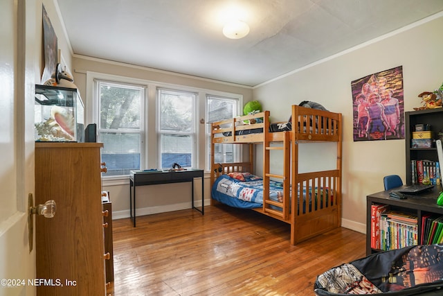 bedroom featuring crown molding and hardwood / wood-style floors