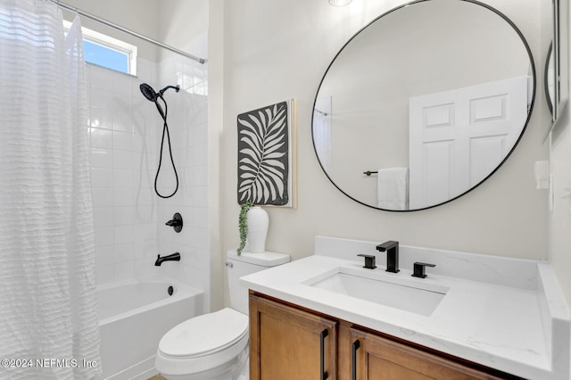 full bathroom featuring vanity, toilet, and shower / tub combo with curtain