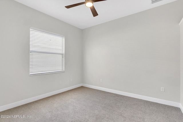 spare room with carpet flooring and ceiling fan