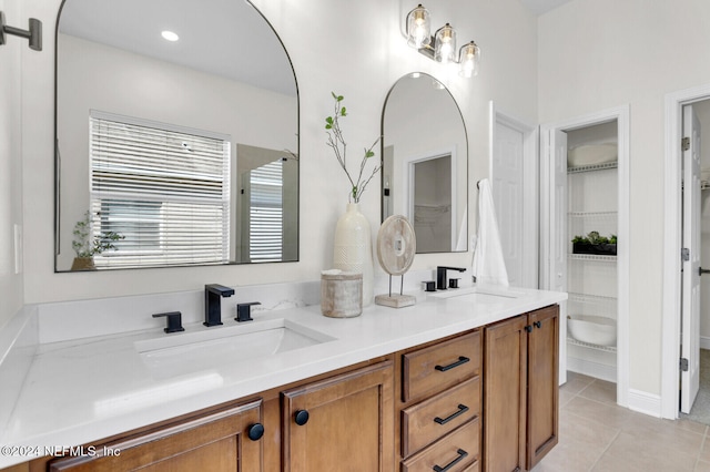 bathroom with tile patterned floors and vanity