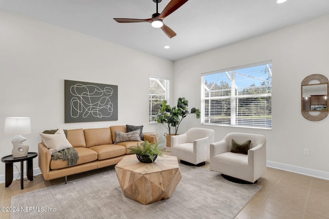 tiled living room featuring ceiling fan