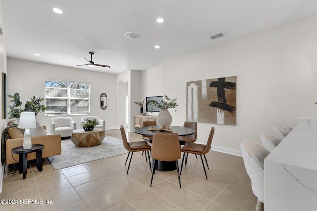 dining space featuring ceiling fan and light tile patterned flooring