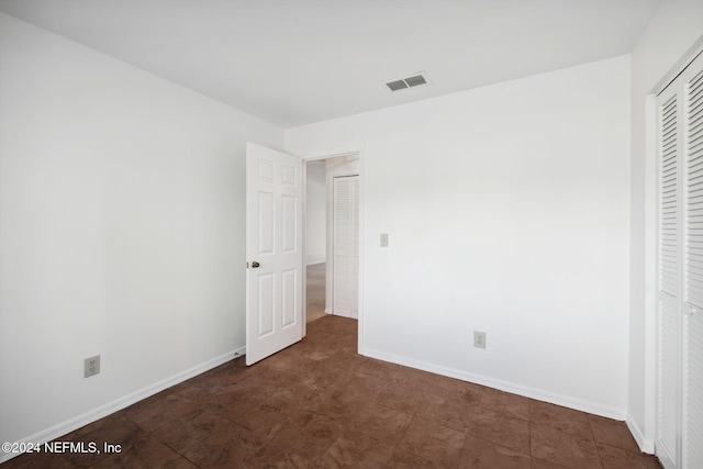 unfurnished bedroom featuring a closet