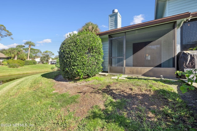 view of yard with a sunroom