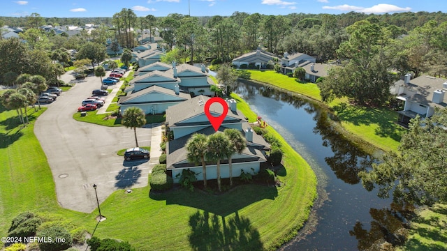 drone / aerial view with a water view