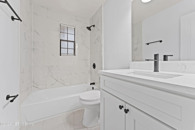 full bathroom with vanity, toilet, and tiled shower / bath