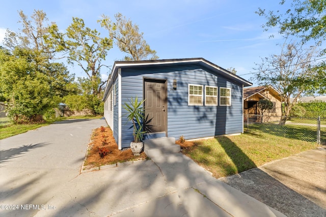 view of outbuilding featuring a yard