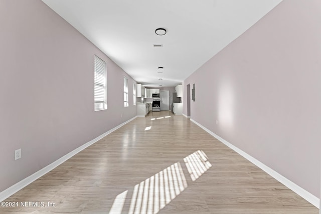 corridor featuring light wood-type flooring