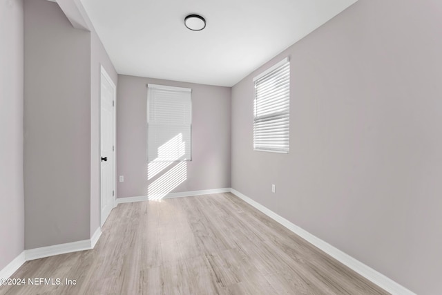 empty room with light wood-type flooring