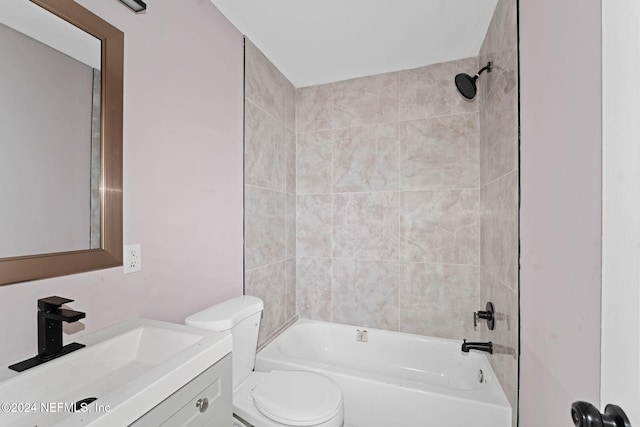 full bathroom featuring vanity, toilet, and tiled shower / bath