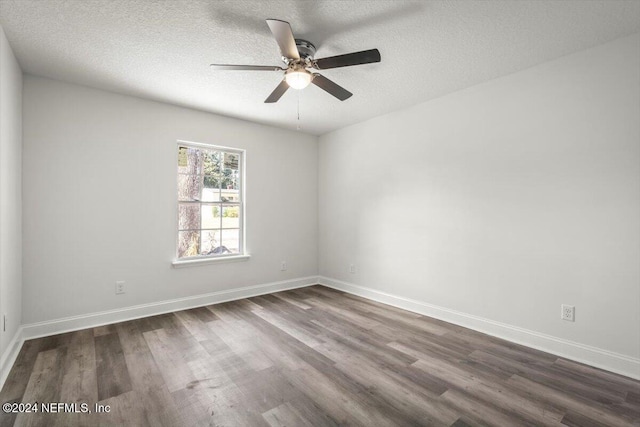 unfurnished room with a textured ceiling, dark hardwood / wood-style floors, and ceiling fan