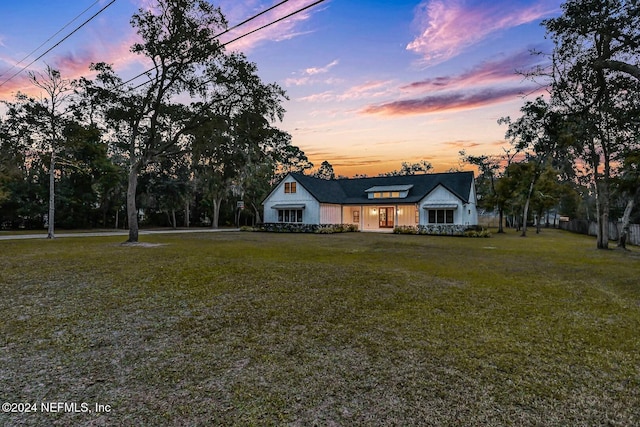 view of front of home with a yard