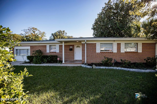 ranch-style house with a front yard