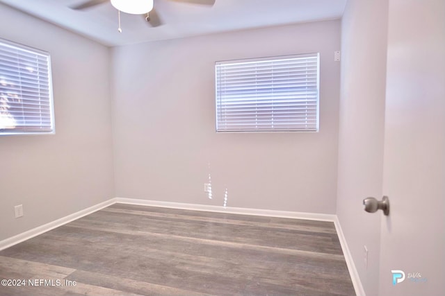 empty room with hardwood / wood-style flooring and ceiling fan