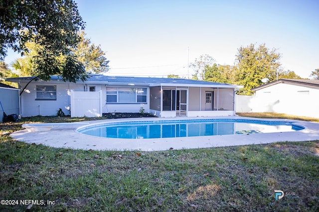 rear view of house with a sunroom