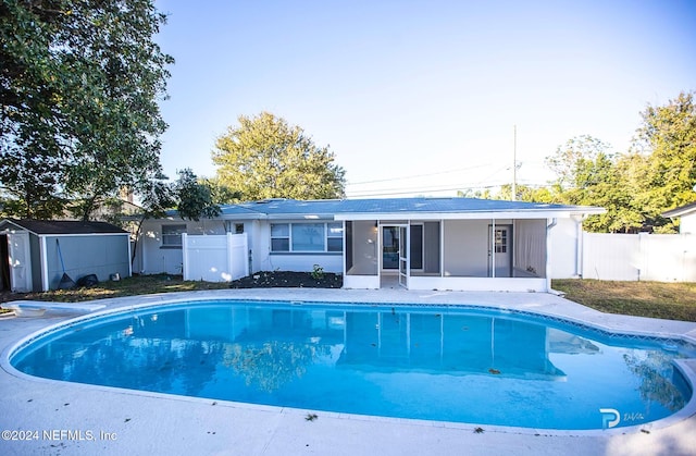 view of pool with a sunroom