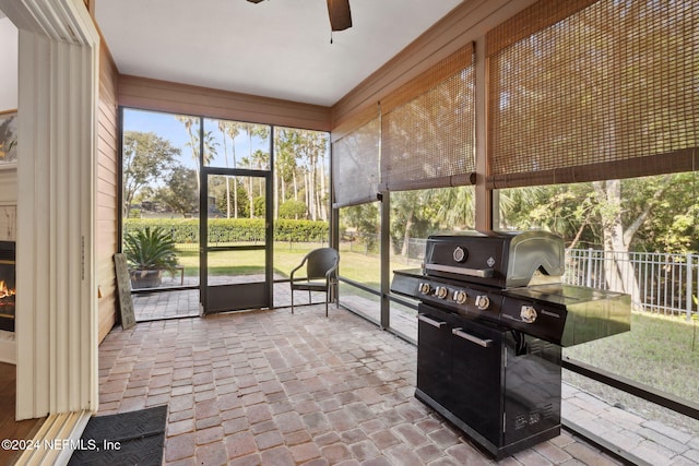 sunroom / solarium with ceiling fan