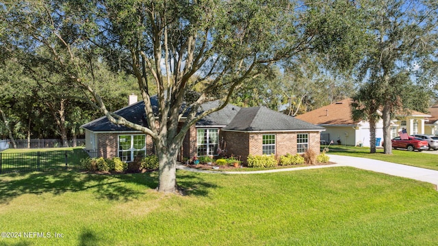 single story home with a front yard