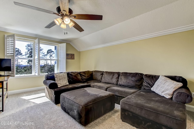 carpeted living room with ceiling fan, lofted ceiling, and ornamental molding