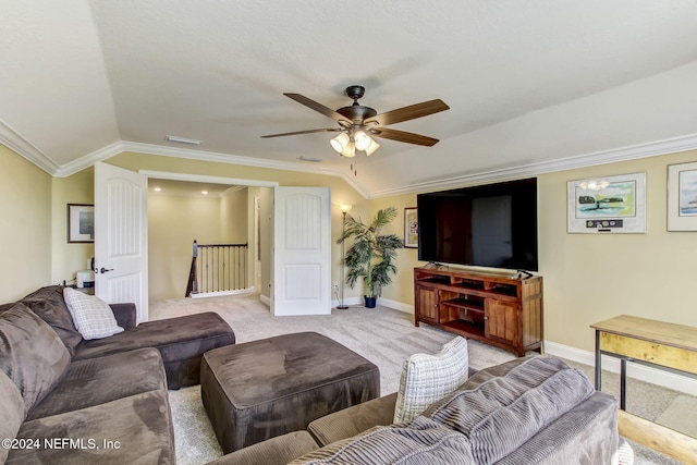 living room featuring ornamental molding, light colored carpet, ceiling fan, and lofted ceiling