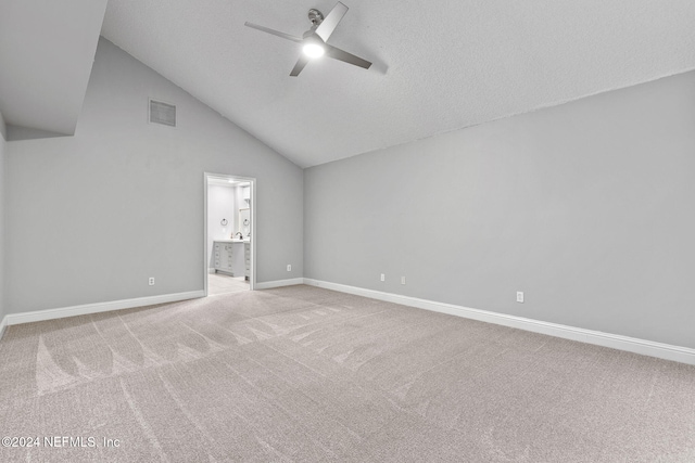 empty room with ceiling fan, light carpet, and high vaulted ceiling