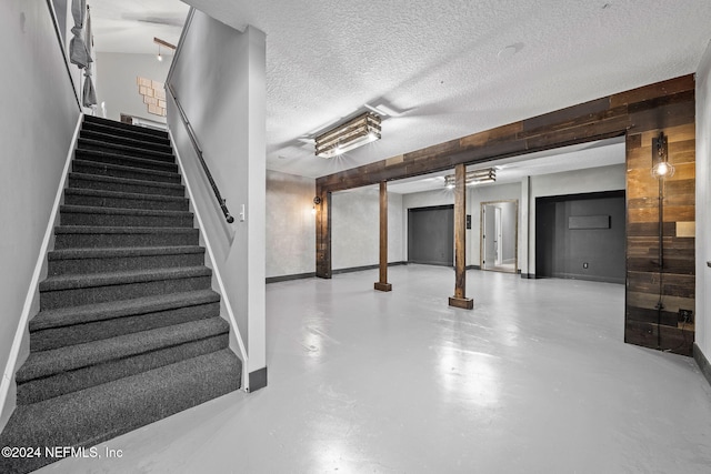 basement with a textured ceiling